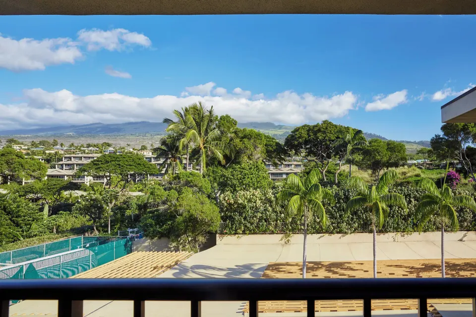 Mountainside Room balcony view of palms and slopes at Four Seasons Resort Maui at Wailea.