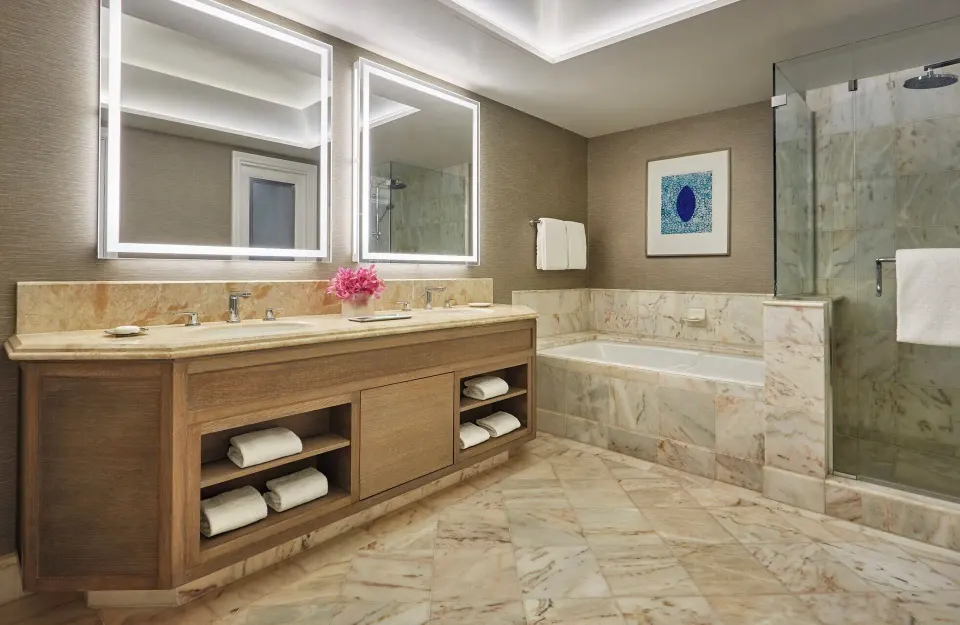 Mountainside Room marble bathroom with tub and shower at Four Seasons Resort Maui at Wailea.