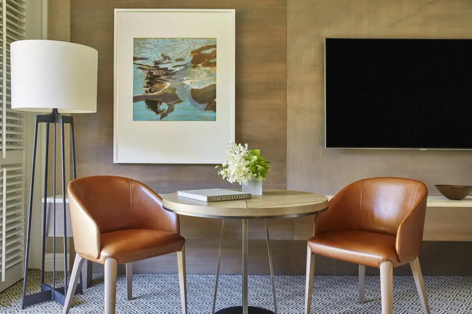 Mountainside Room sitting area with two chairs at Four Seasons Resort Maui at Wailea.