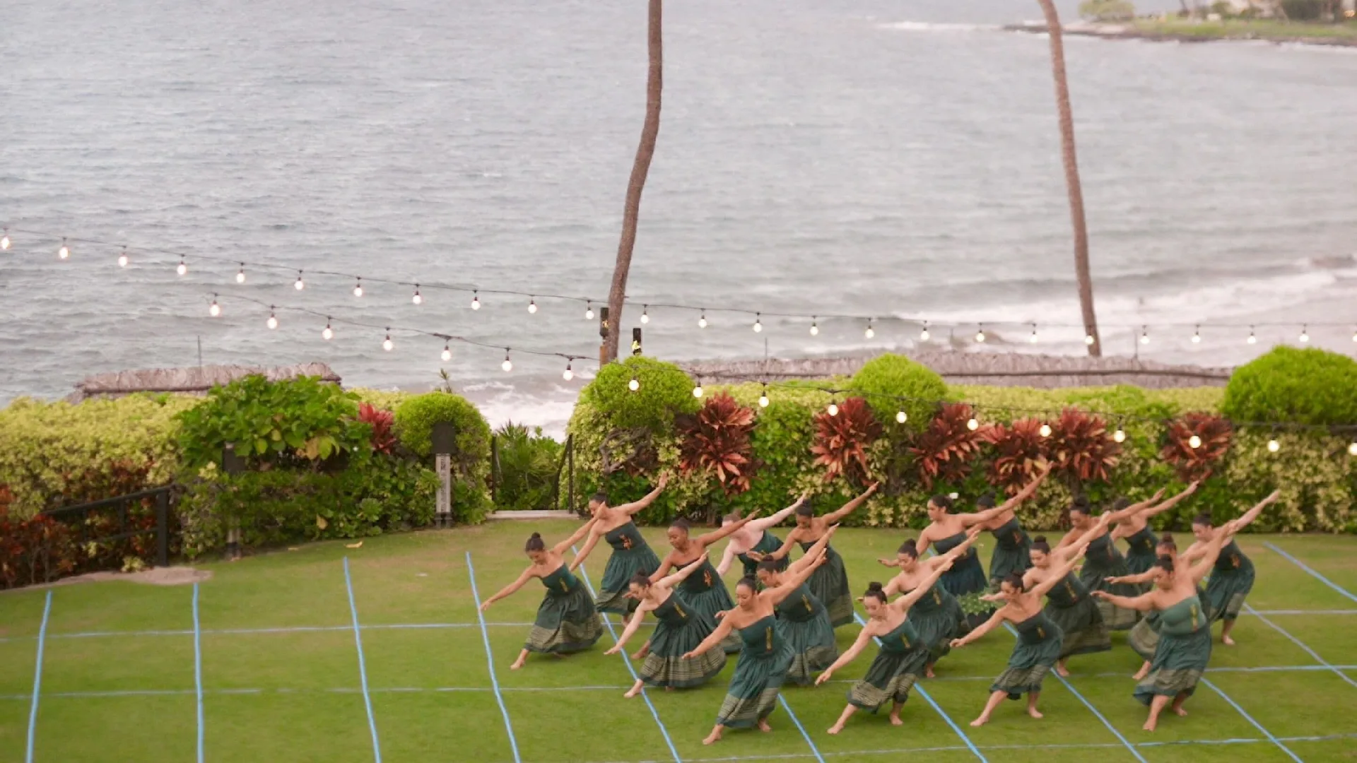 Dancers performing on an oceanfront lawn at Four Seasons Resort Maui at Wailea.