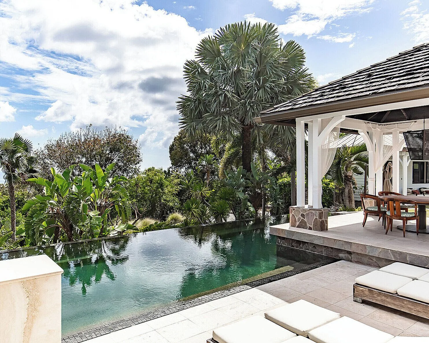 Private pool beside an open-air pavilion at Four Seasons Resort Nevis.