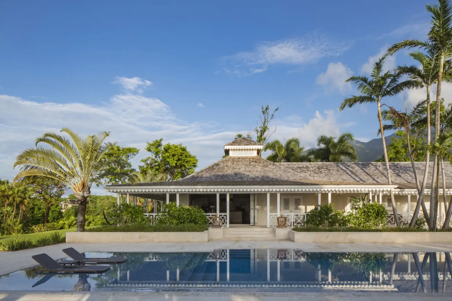Reflecting pool and white pavilion building at Four Seasons Resort Nevis.