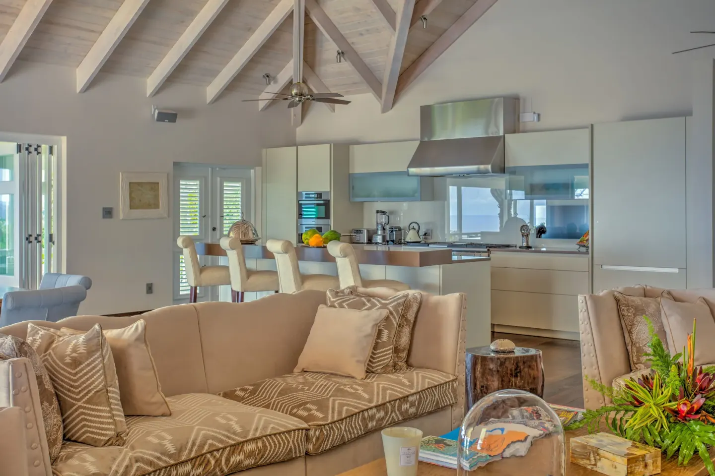 Open living room and kitchen in a resort residence at Four Seasons Resort Nevis.