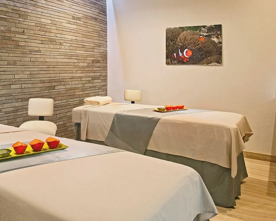 Spa treatment room with two massage beds at Four Seasons Resort Nevis.