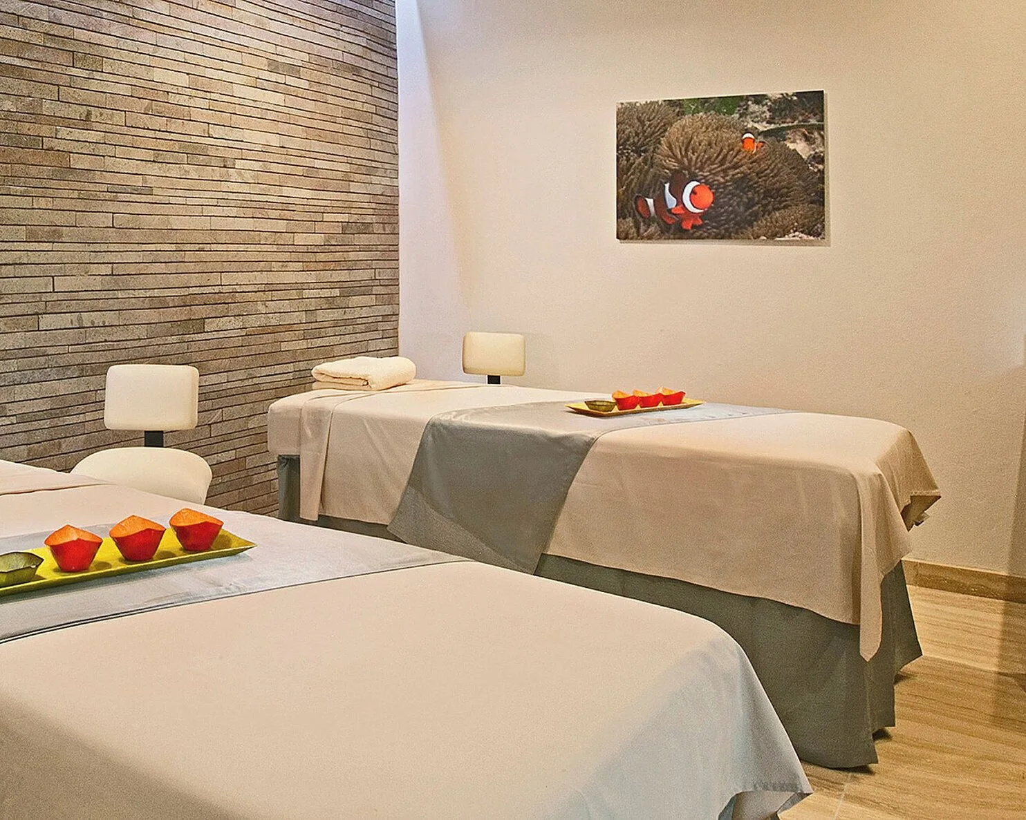 Spa treatment room with two massage beds at Four Seasons Resort Nevis.