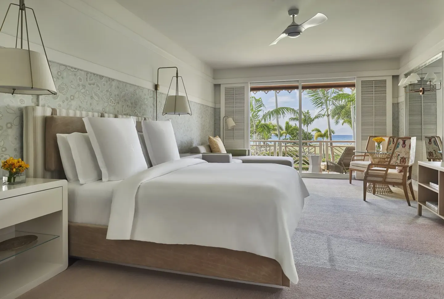 Alexander Suite bedroom with king bed and balcony view at Four Seasons Resort Nevis.