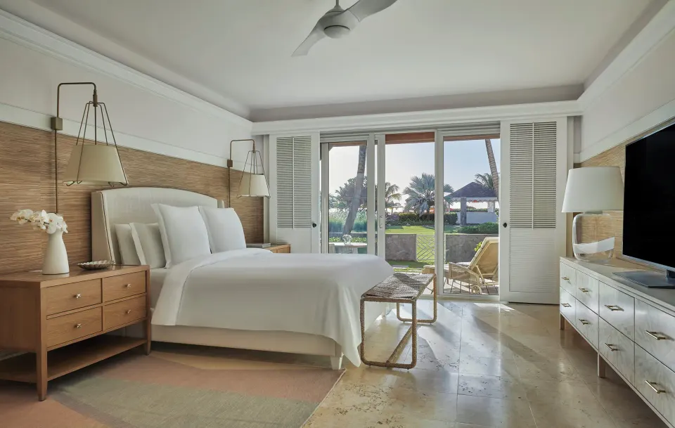 Chelanii Suite king bedroom with terrace doors at Four Seasons Resort Nevis.