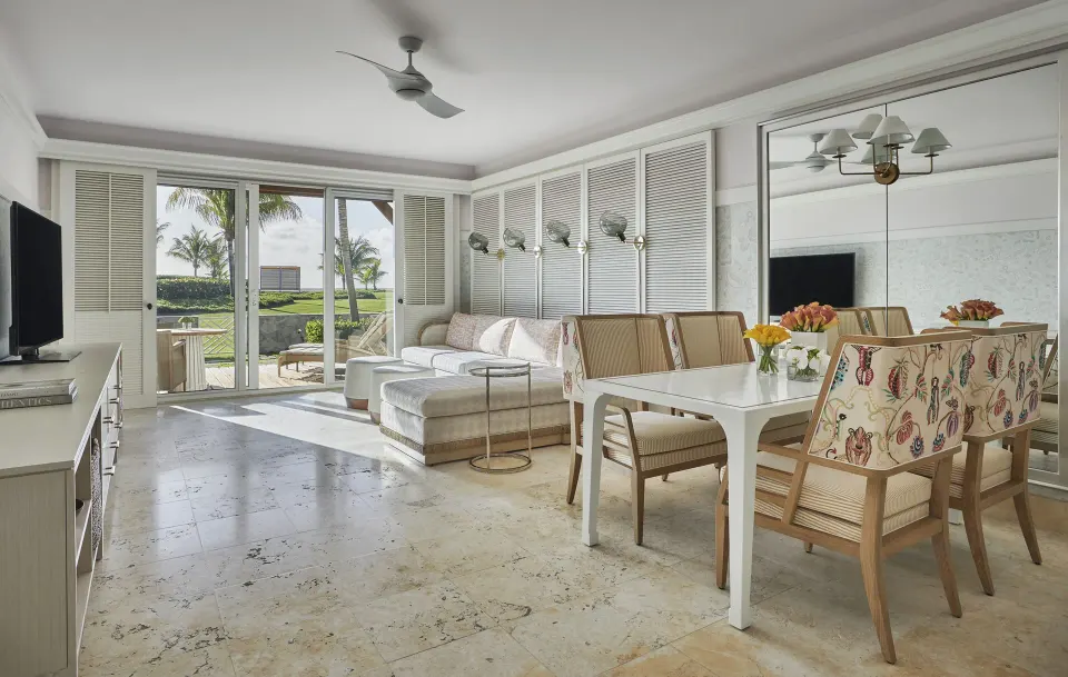 Chelanii Suite living and dining area with terrace doors at Four Seasons Resort Nevis.