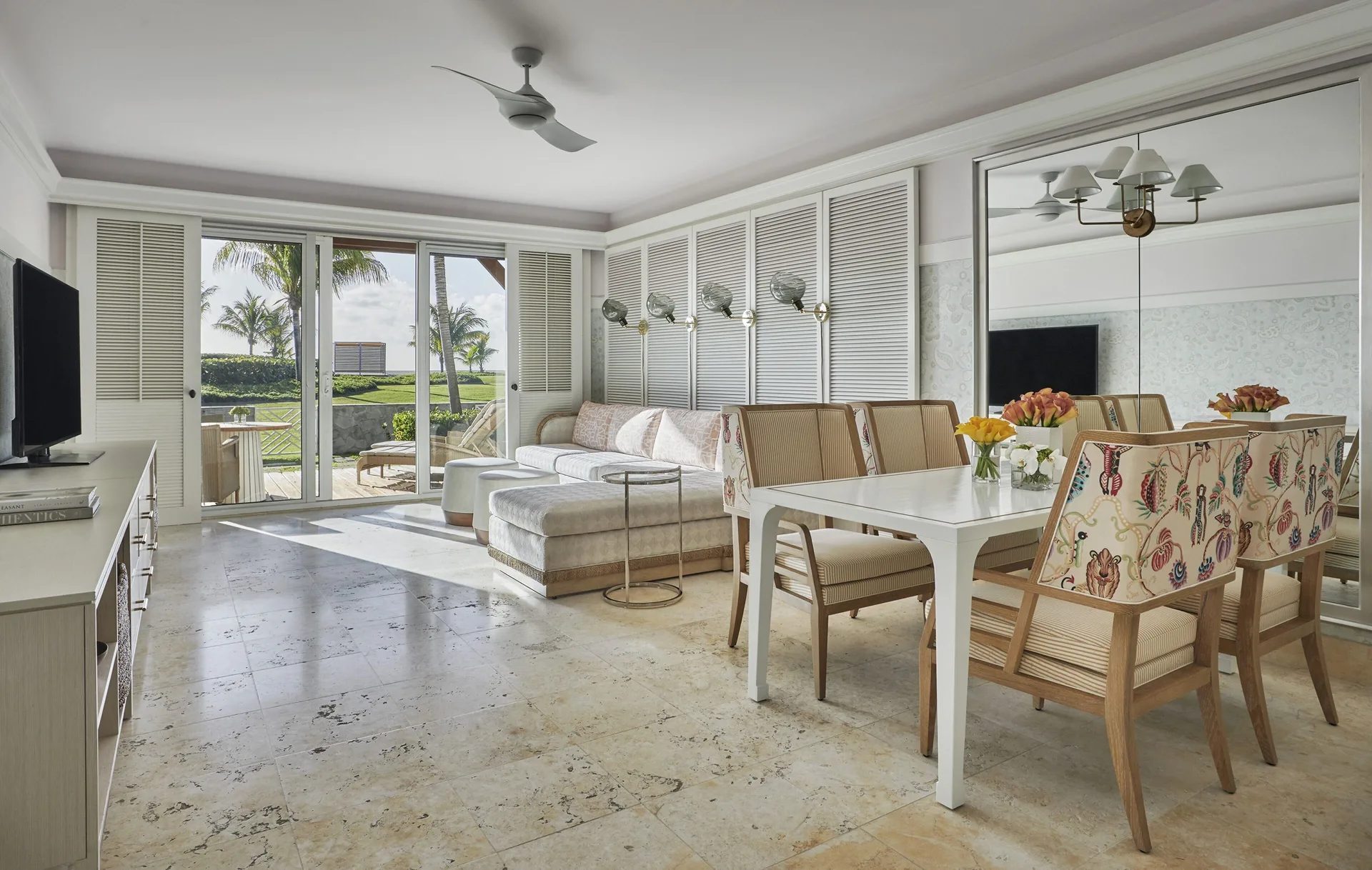 Chelanii Suite living and dining area with terrace doors at Four Seasons Resort Nevis.