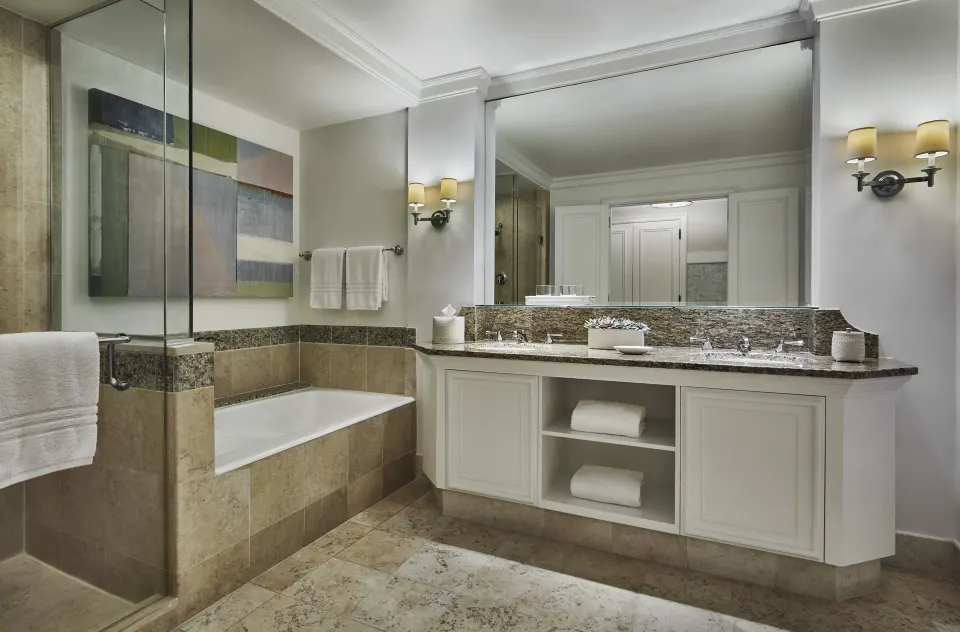 Nevis Peak View room bathroom with tub and double vanity at Four Seasons Resort Nevis.