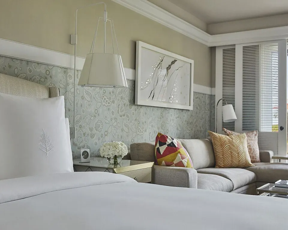 Nevis Peak View room bed and sofa seating at Four Seasons Resort Nevis.