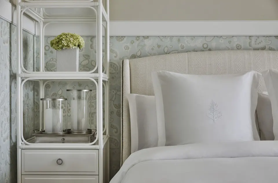 Nevis Peak View room bed and bedside shelving at Four Seasons Resort Nevis.