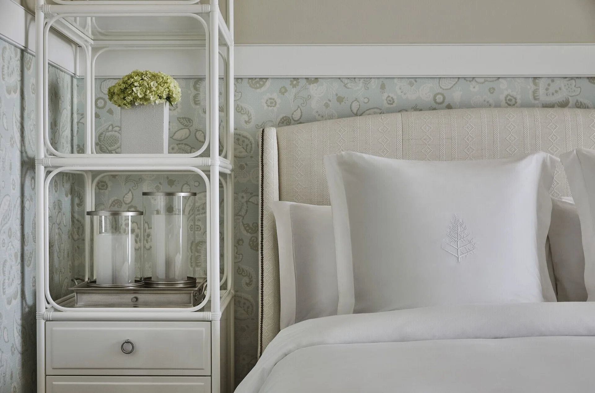Nevis Peak View room bed and bedside shelving at Four Seasons Resort Nevis.