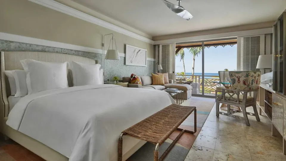 Ocean View Room with king bed and balcony view at Four Seasons Resort Nevis.
