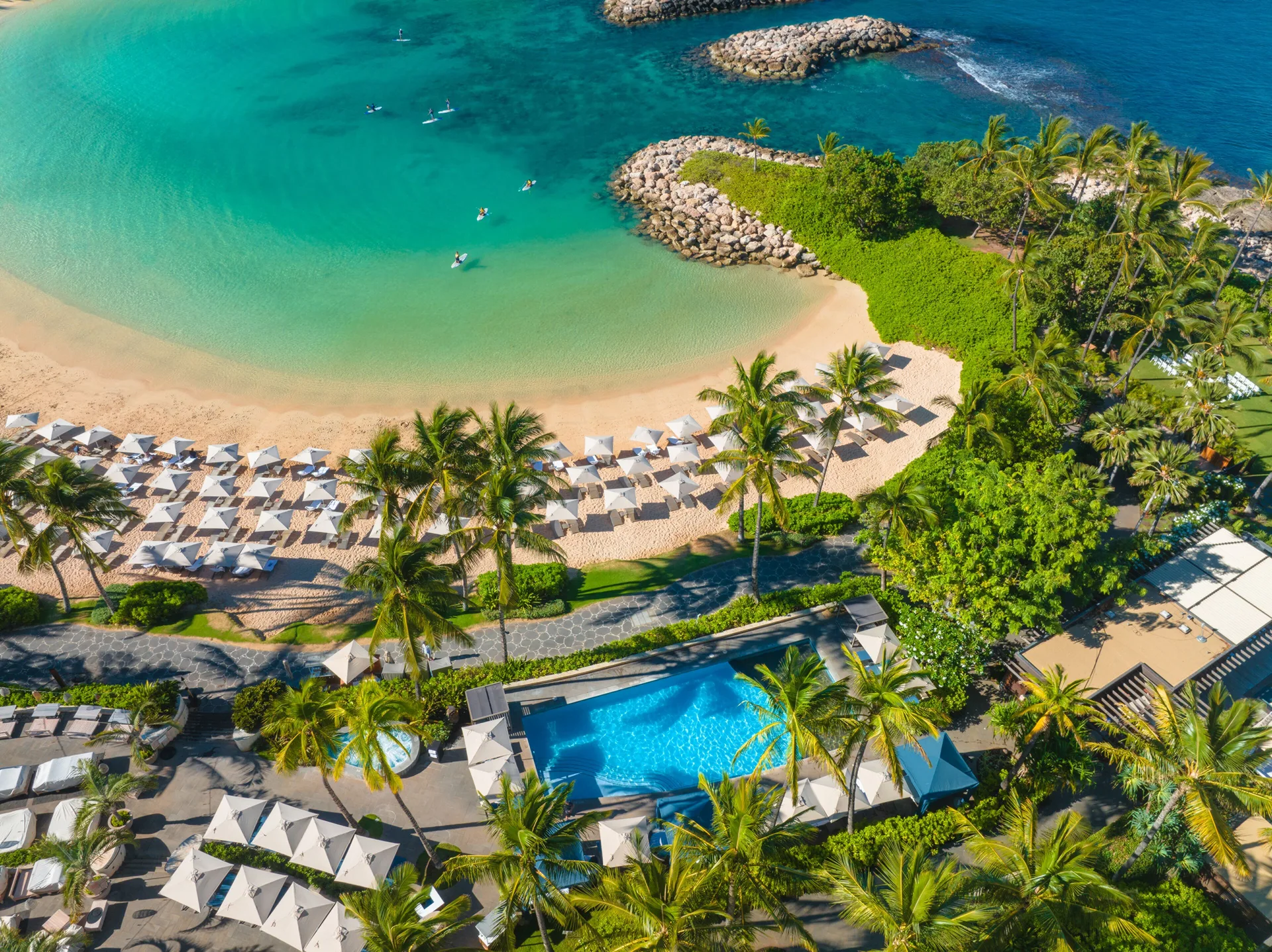 Aerial view of the beach, lagoon and pool at Four Seasons Resort Oahu at Ko Olina.