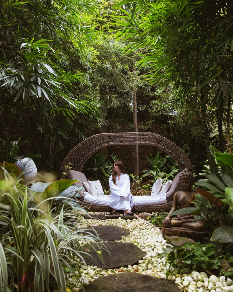 A garden daybed in a lush spa setting at Four Seasons Resort Oahu at Ko Olina.