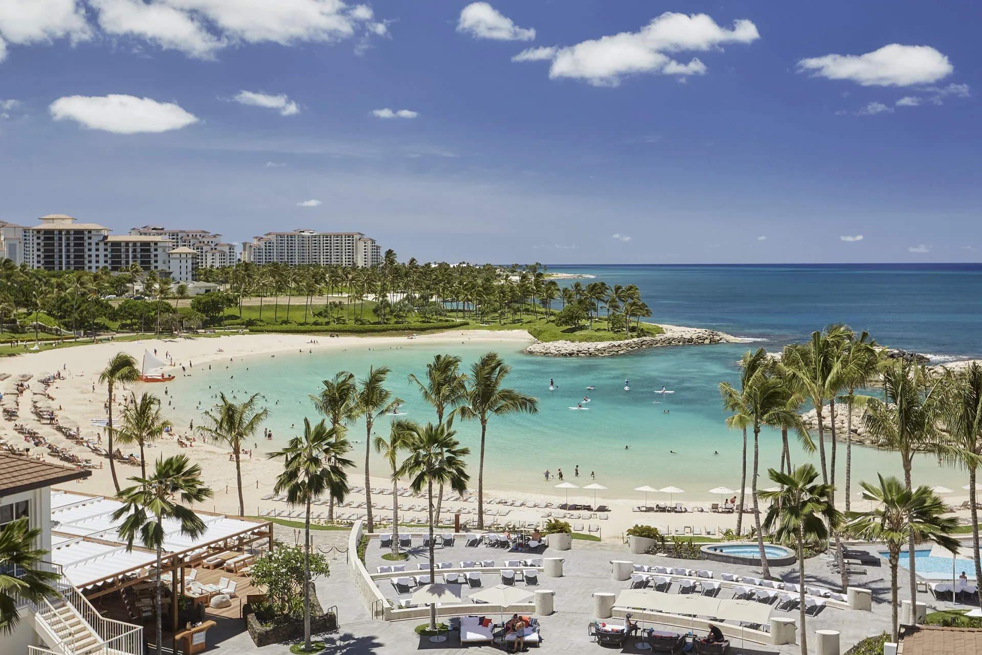 Wide view of the lagoon beach and resort grounds at Four Seasons Resort Oahu at Ko Olina.