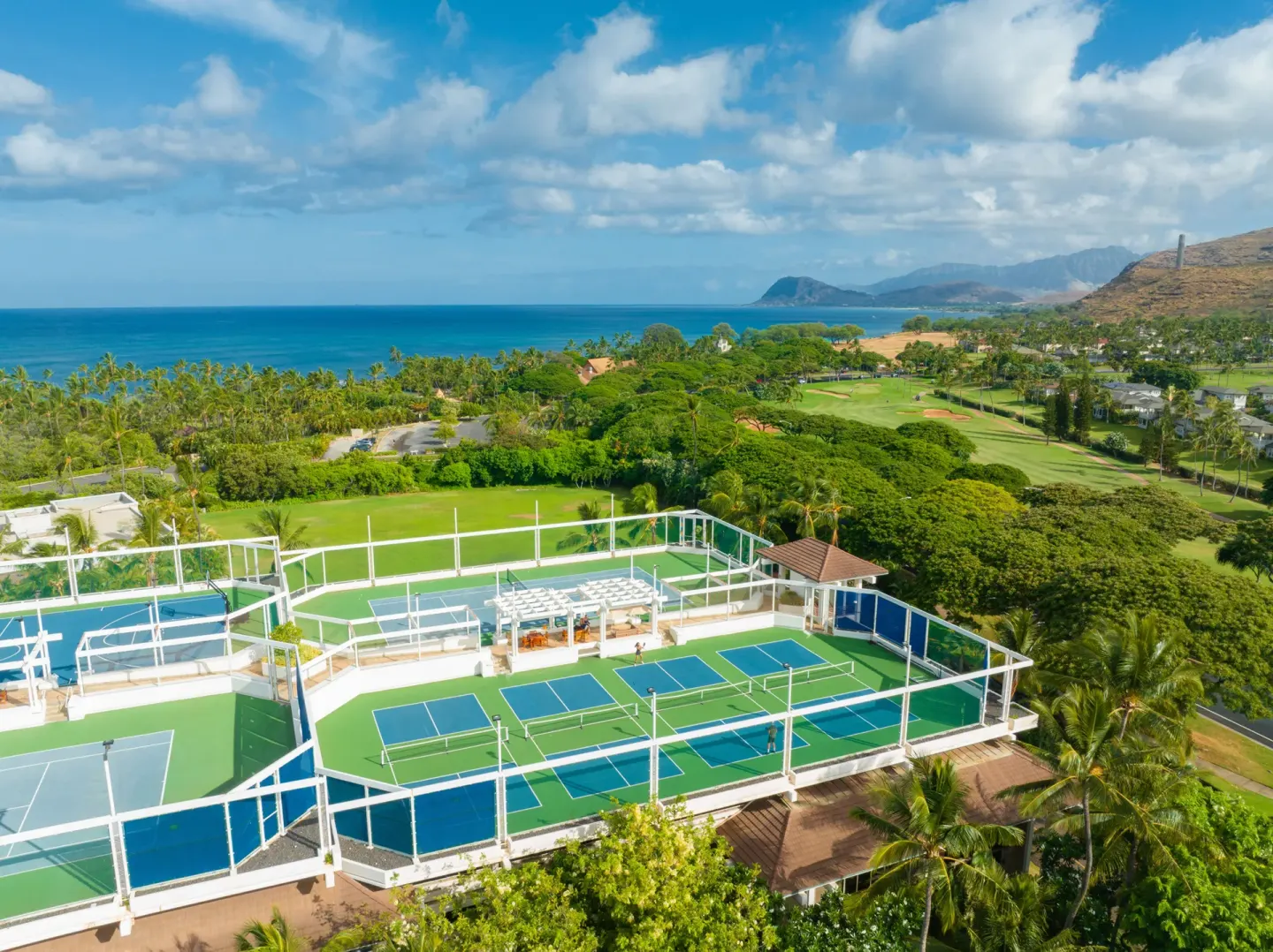 Rooftop tennis courts with ocean and mountain views at Four Seasons Resort Oahu at Ko Olina.