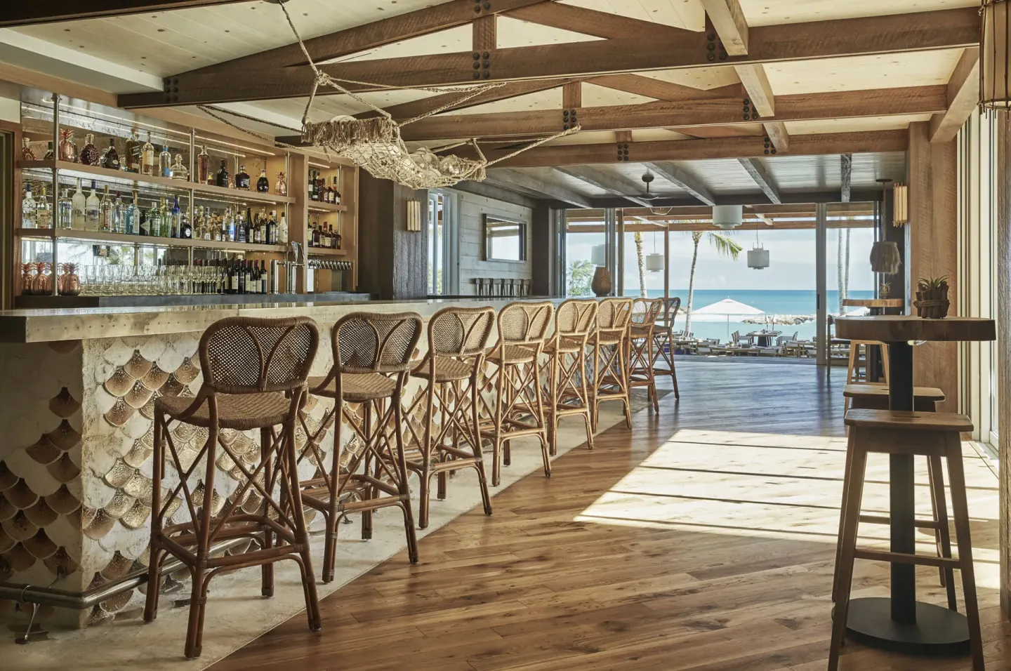 Ocean-view bar with wicker stools at Four Seasons Resort Oahu at Ko Olina.