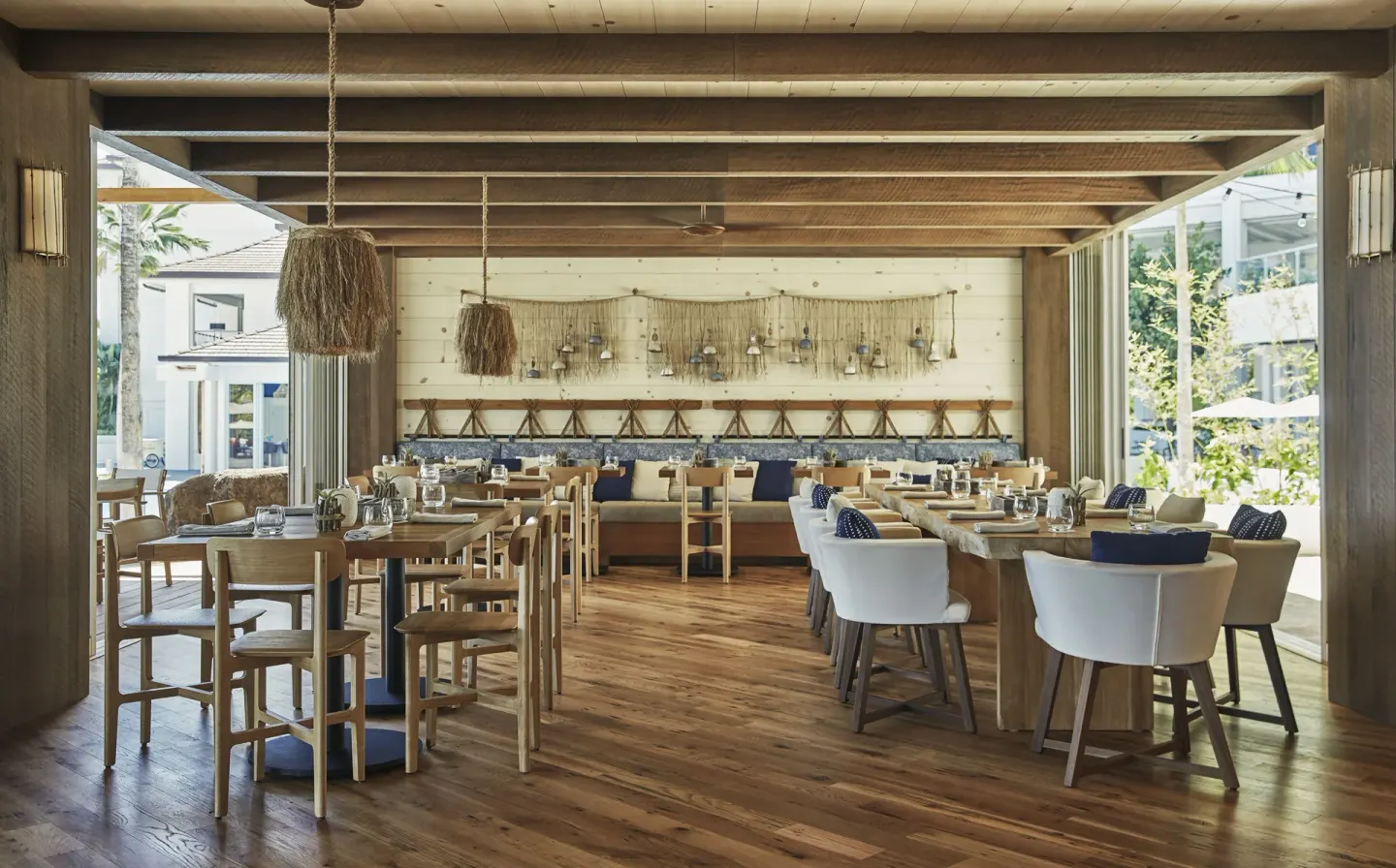 Wood-accented open-air dining room at Four Seasons Resort Oahu at Ko Olina.