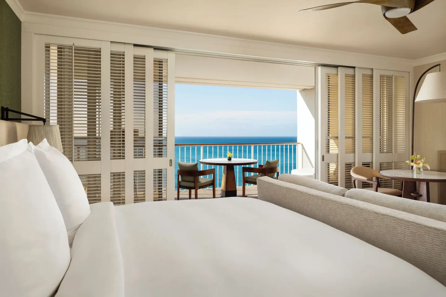 Club Oceanfront Room king bed facing an ocean balcony at Four Seasons Resort Oahu at Ko Olina.