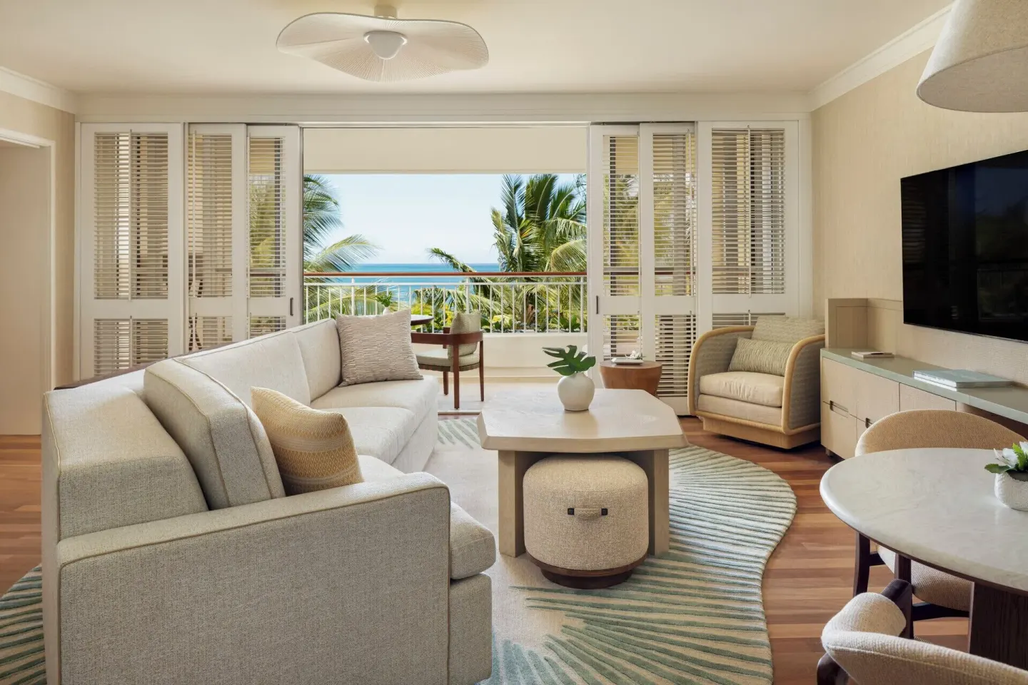 Oceanfront suite living room with balcony at Four Seasons Resort Oahu at Ko Olina.
