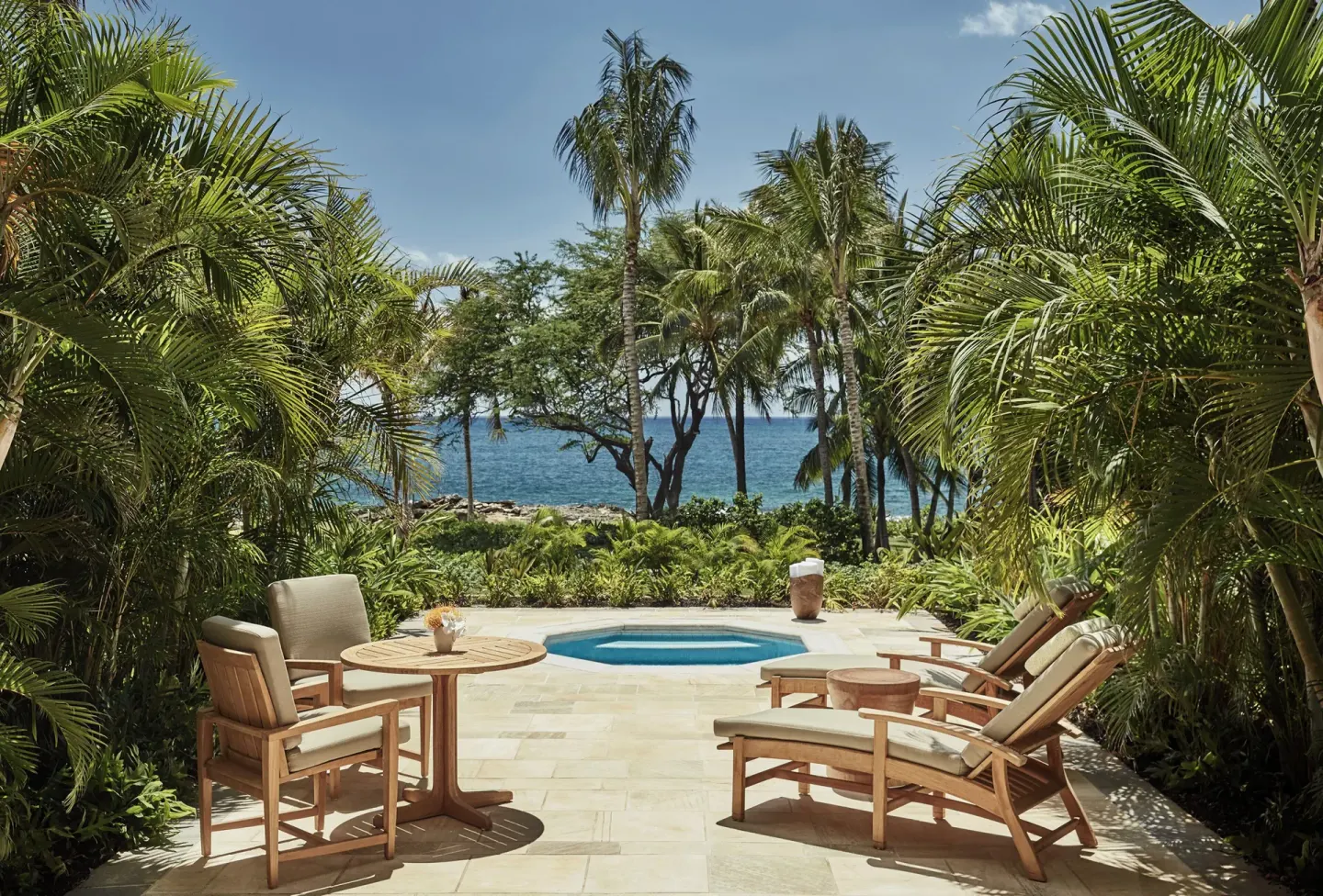 Club Room patio with outdoor spa tub and ocean view at Four Seasons Resort Oahu at Ko Olina.