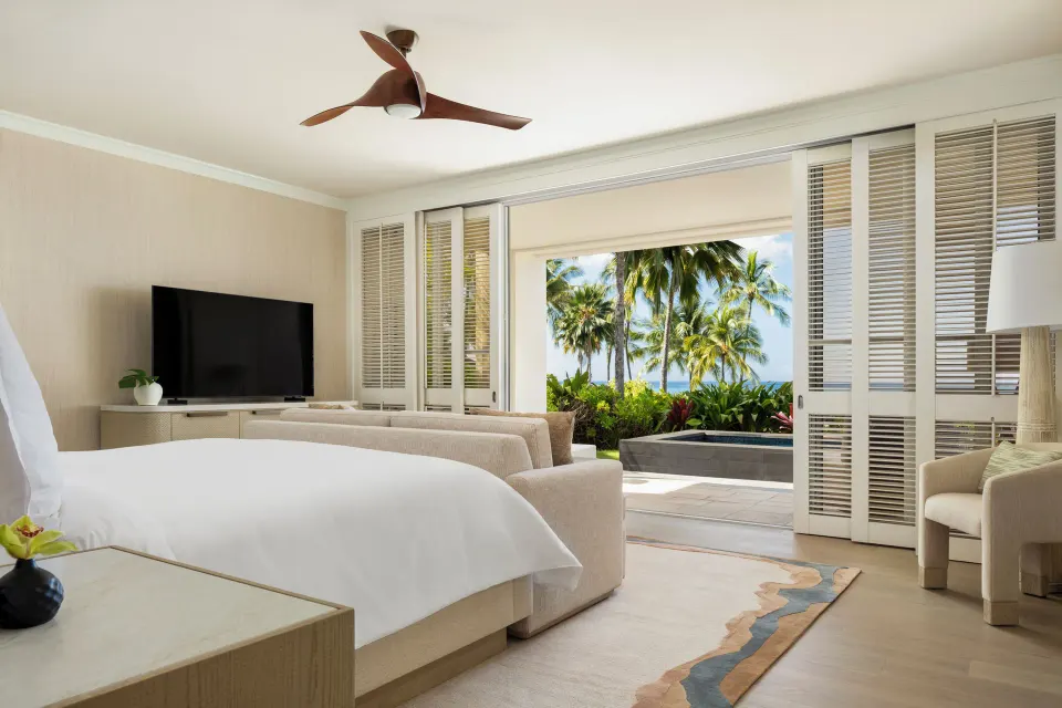 Pacific Suite bedroom at Four Seasons Resort Oahu at Ko Olina with king bed, sofa and garden terrace.