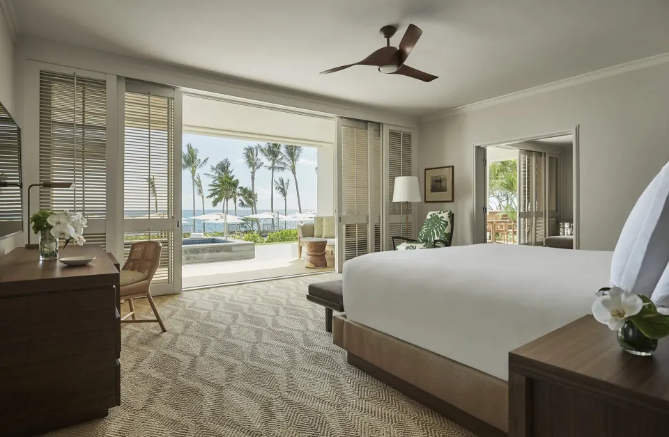 Pacific Suite bedroom at Four Seasons Resort Oahu at Ko Olina with king bed and open terrace view.