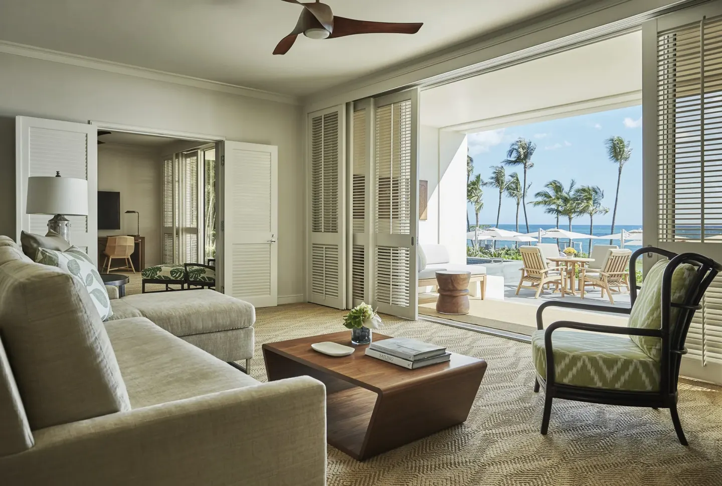 Pacific Suite living room at Four Seasons Resort Oahu at Ko Olina with doors open to oceanfront terrace.