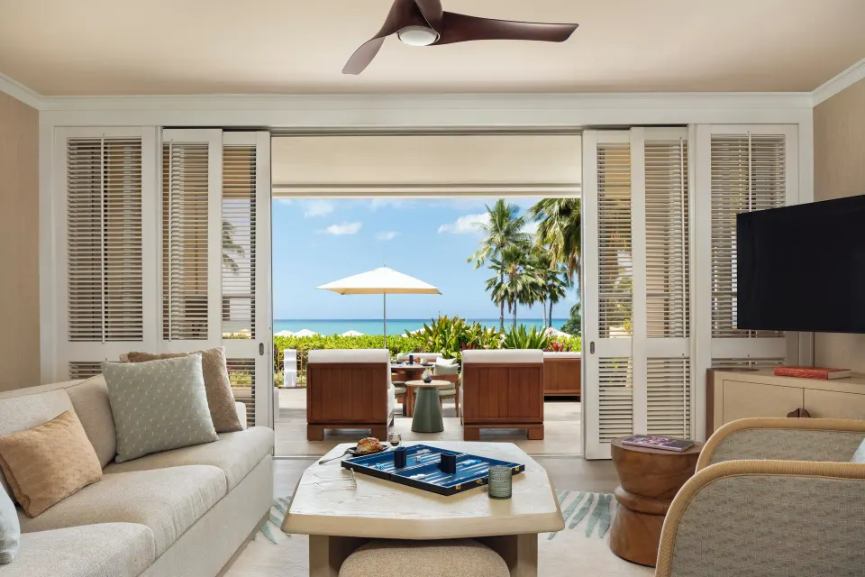Pacific Suite living room at Four Seasons Resort Oahu at Ko Olina with sofa and oceanfront terrace.