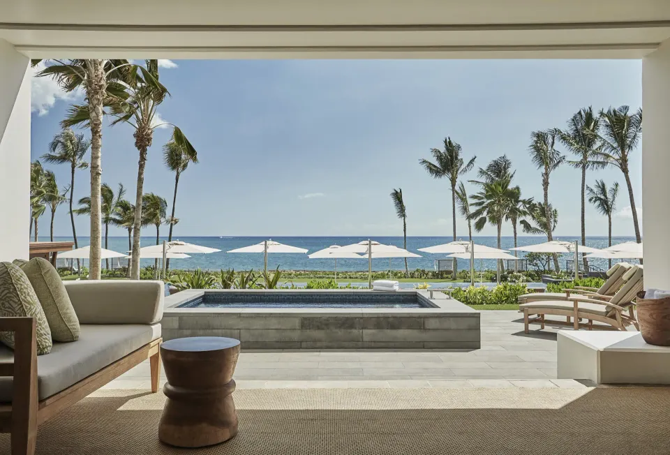 Pacific Suite terrace at Four Seasons Resort Oahu at Ko Olina with plunge pool, palms and ocean view.