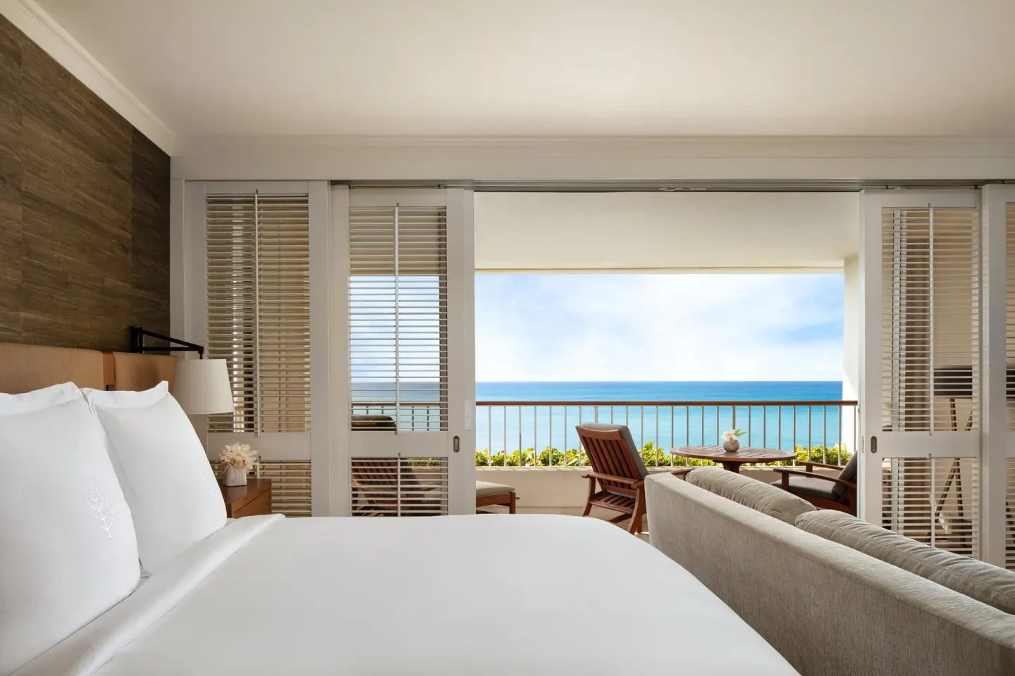 Oceanfront room bed facing the balcony at Four Seasons Resort Oahu at Ko Olina.