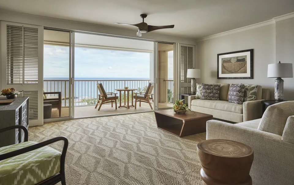 Studio Suite Oceanfront lounge with furnished balcony at Four Seasons Resort Oahu at Ko Olina.