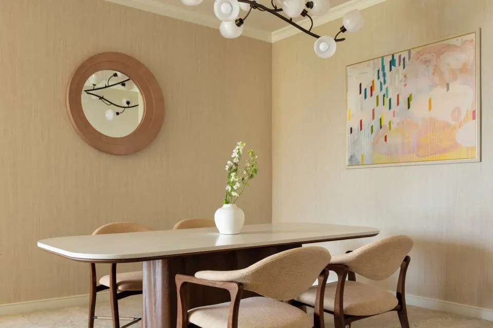 Sunset Suite dining area with four chairs and wall art at Four Seasons Resort Oahu at Ko Olina.