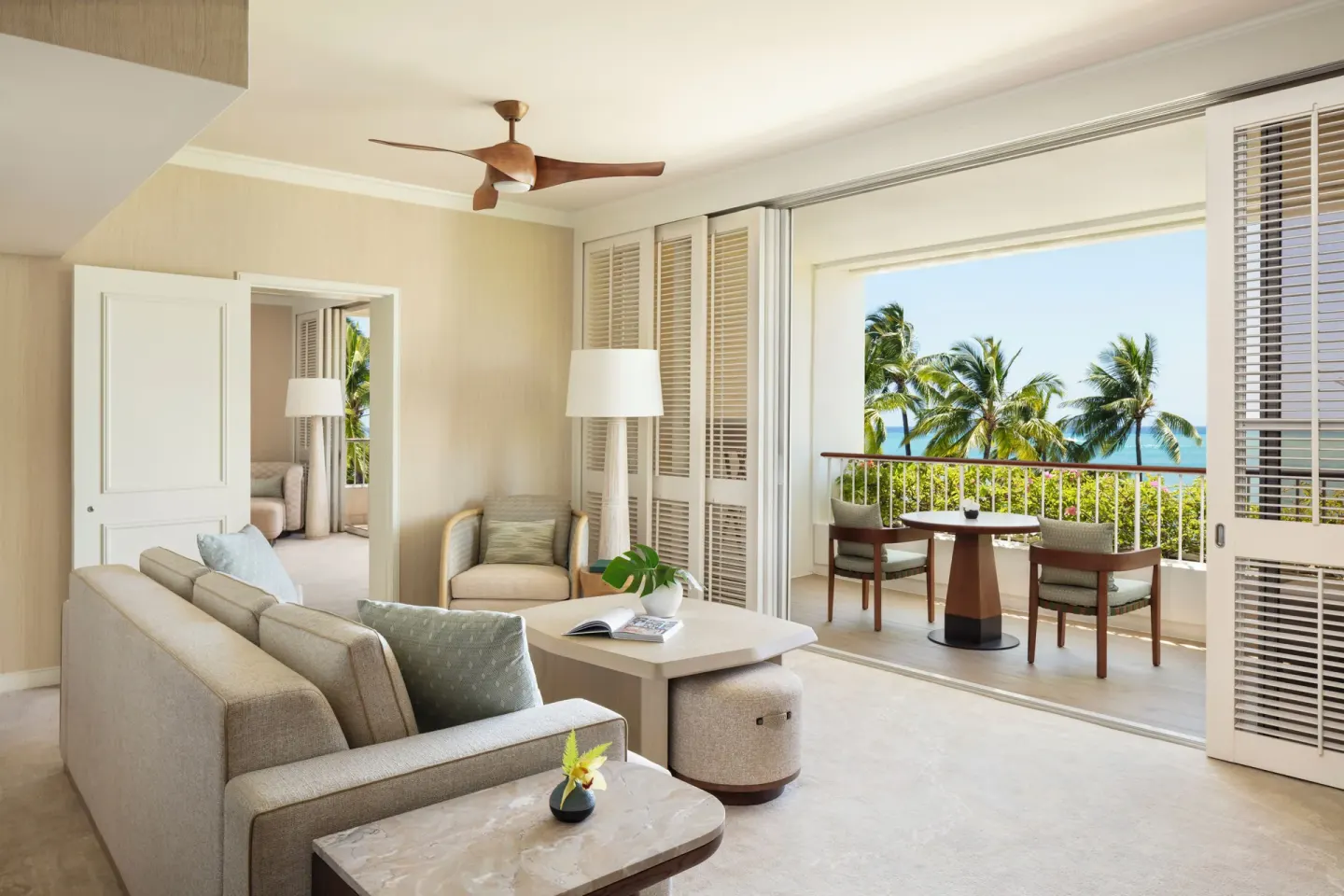 Sunset Suite living room with ocean-view lanai at Four Seasons Resort Oahu at Ko Olina.