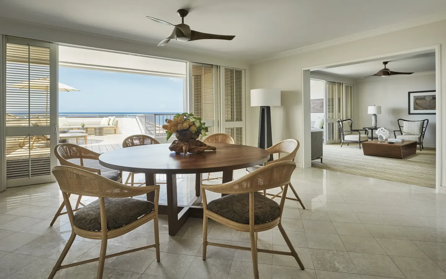 Residence dining area and lounge with ocean terrace at Four Seasons Resort Oahu at Ko Olina.