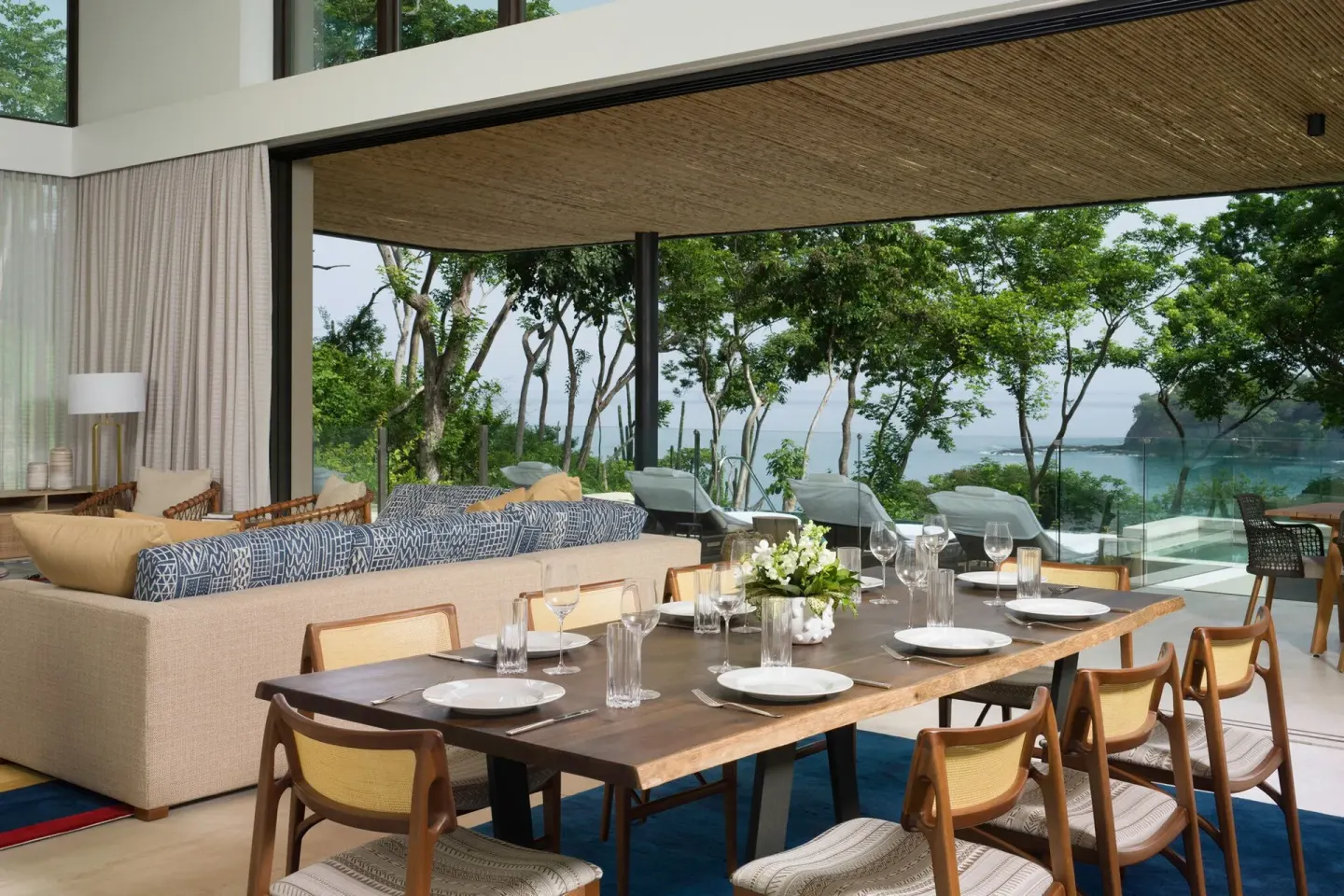 Indoor-outdoor dining area and lounge at Four Seasons Resort Peninsula Papagayo, Costa Rica.