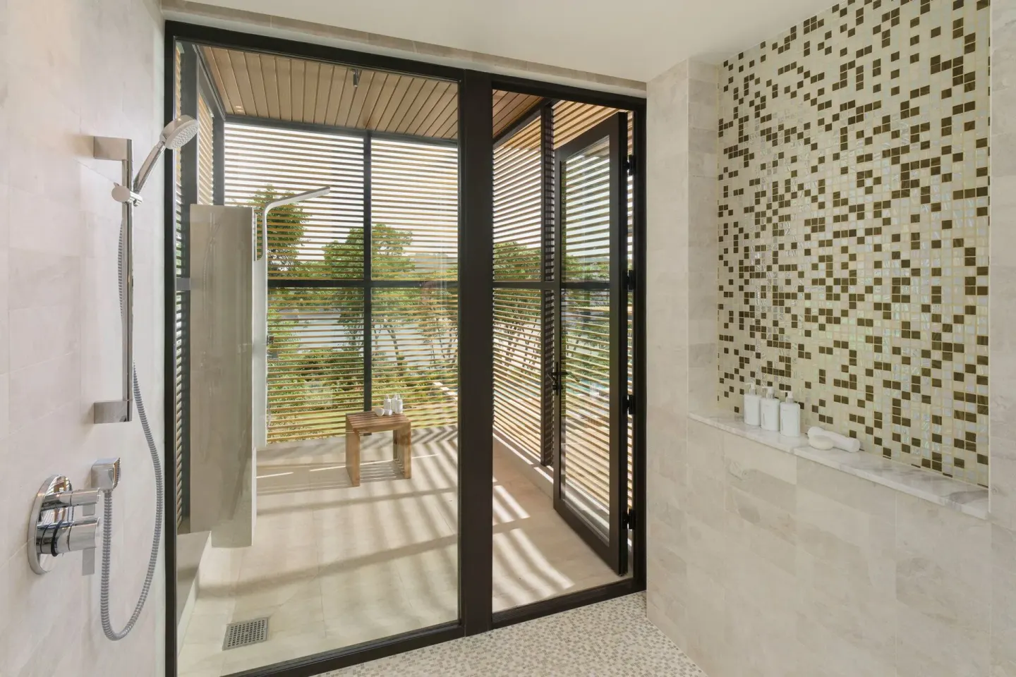 Indoor-outdoor shower with mosaic tile at Four Seasons Resort Peninsula Papagayo, Costa Rica.