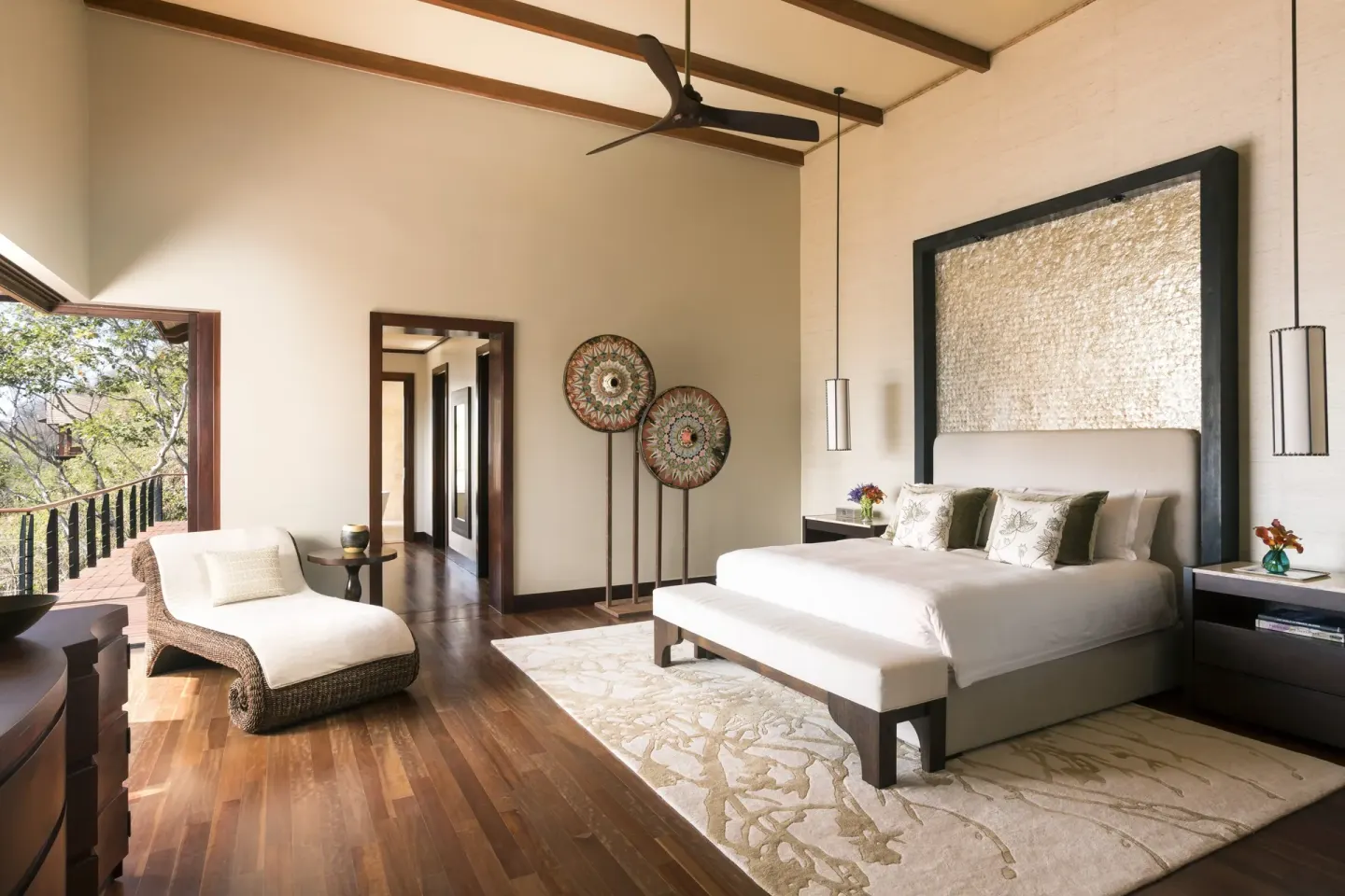 King bedroom with balcony doors at Four Seasons Resort Peninsula Papagayo, Costa Rica.
