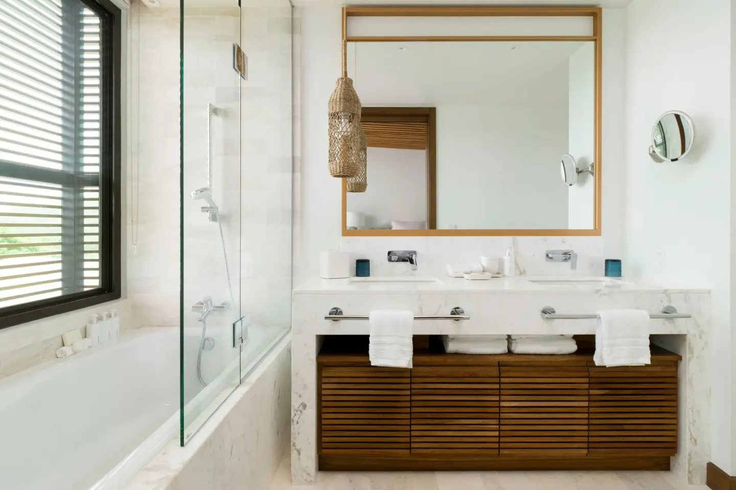 Marble bathroom with tub and double vanity at Four Seasons Resort Peninsula Papagayo, Costa Rica.