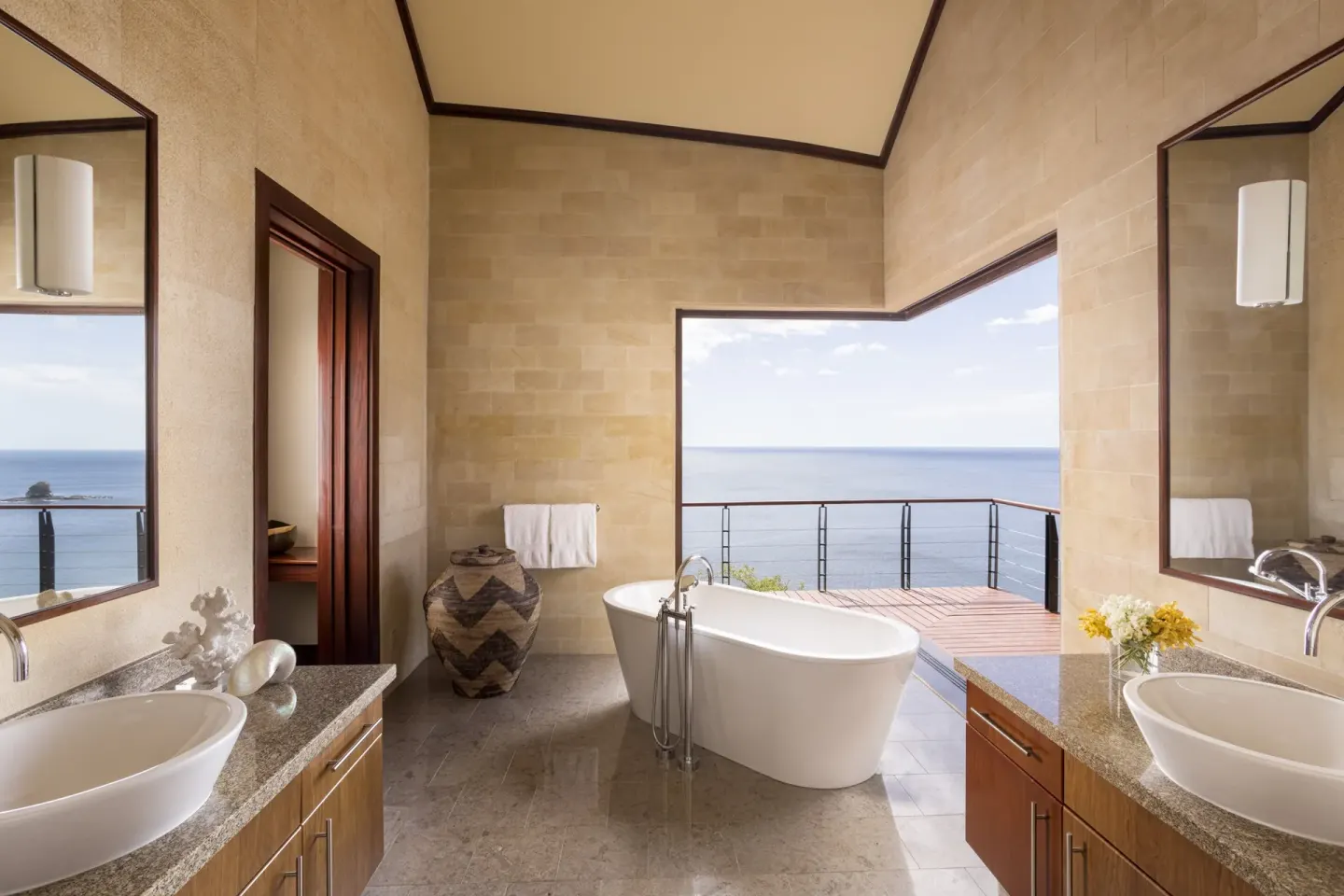 Ocean-view bathroom with freestanding tub at Four Seasons Resort Peninsula Papagayo, Costa Rica.