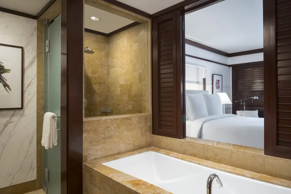 Bathroom tub and shower with the guest room beyond at Four Seasons Resort Peninsula Papagayo, Costa Rica.