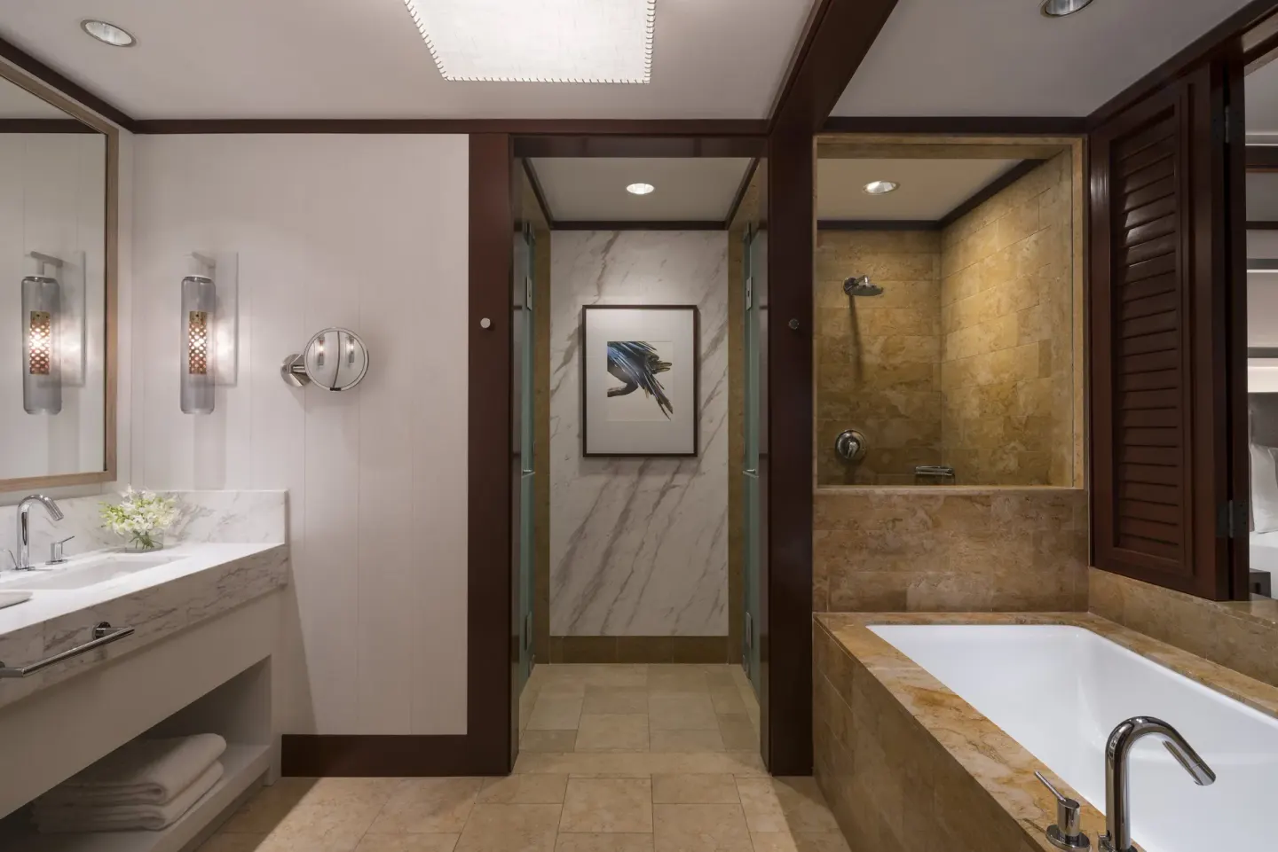 Marble vanity, soaking tub and shower in a bathroom at Four Seasons Resort Peninsula Papagayo, Costa Rica.