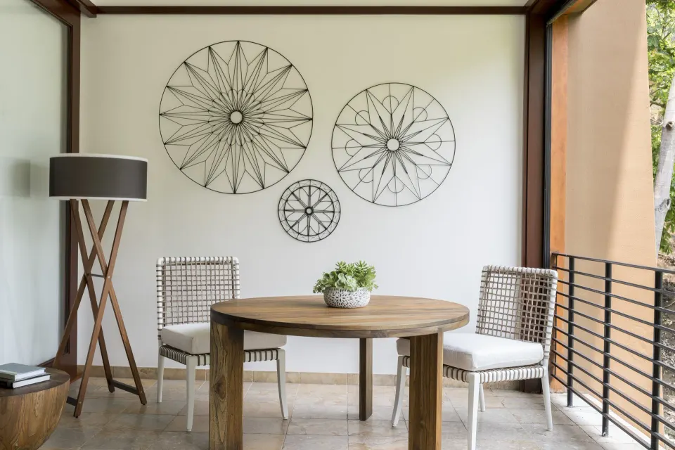 Covered terrace dining table and chairs at Four Seasons Resort Peninsula Papagayo, Costa Rica.