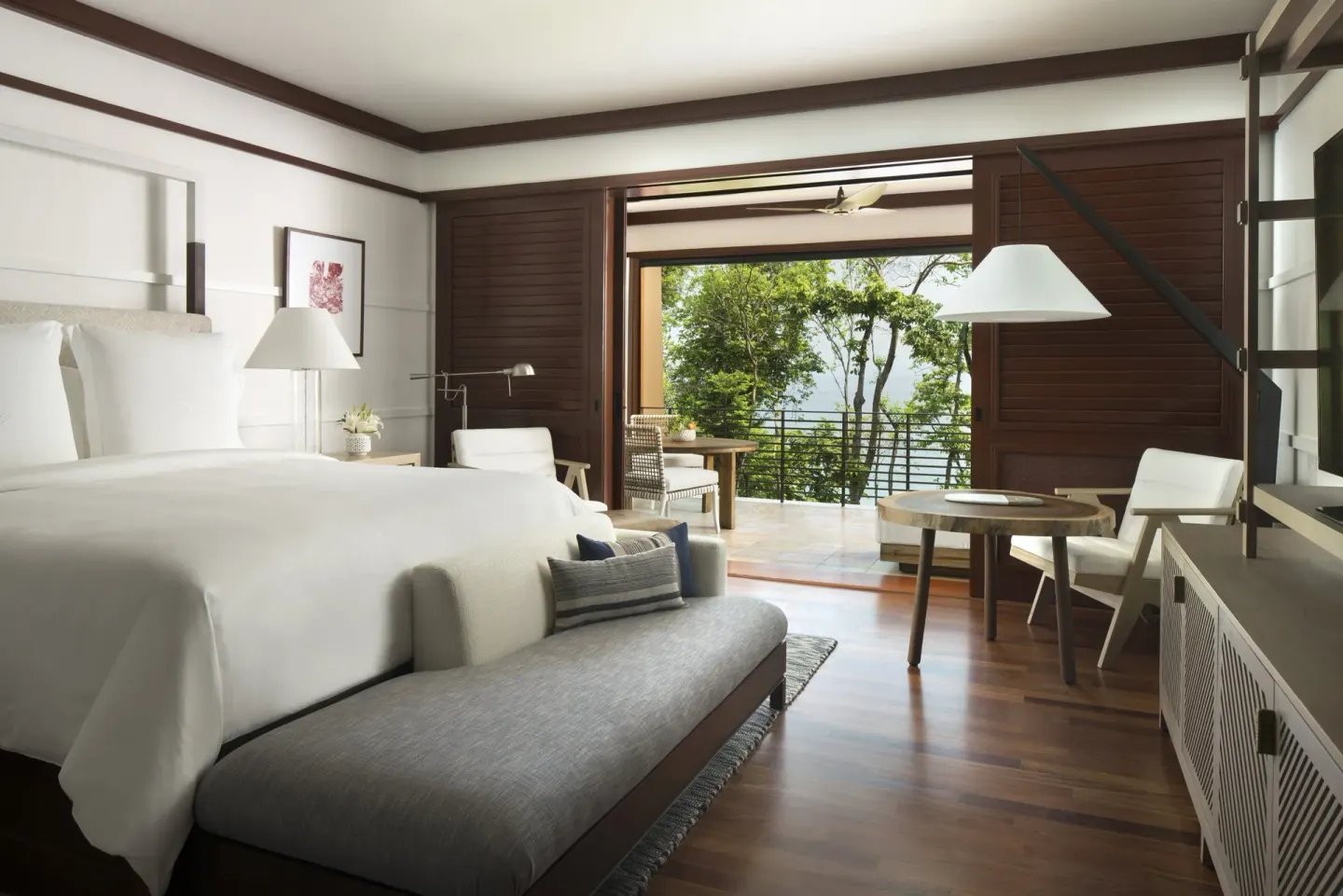 Terrace room with king bed and open balcony at Four Seasons Resort Peninsula Papagayo, Costa Rica.