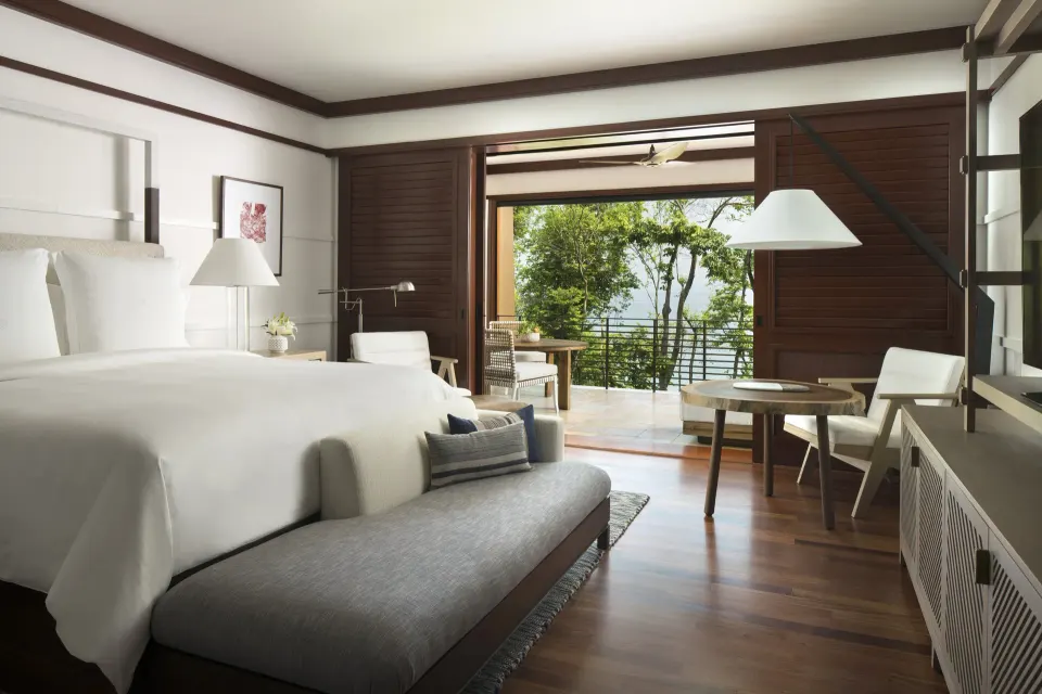 Terrace room with king bed and open balcony at Four Seasons Resort Peninsula Papagayo, Costa Rica.