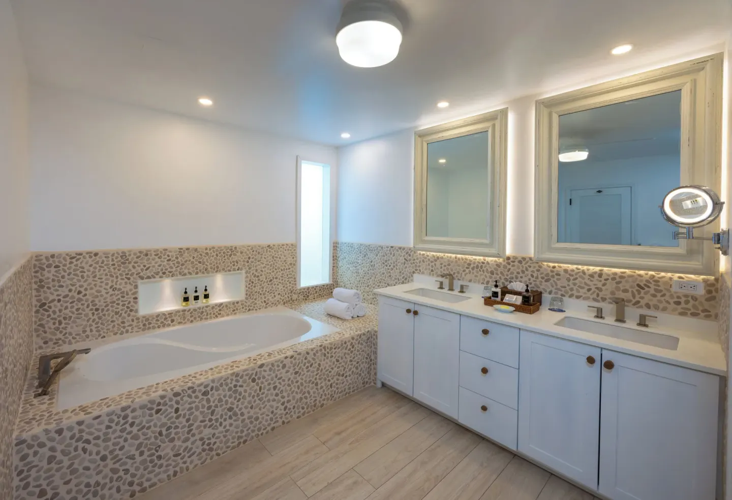 Guest bathroom with soaking tub and double vanity at Galley Bay Resort & Spa.
