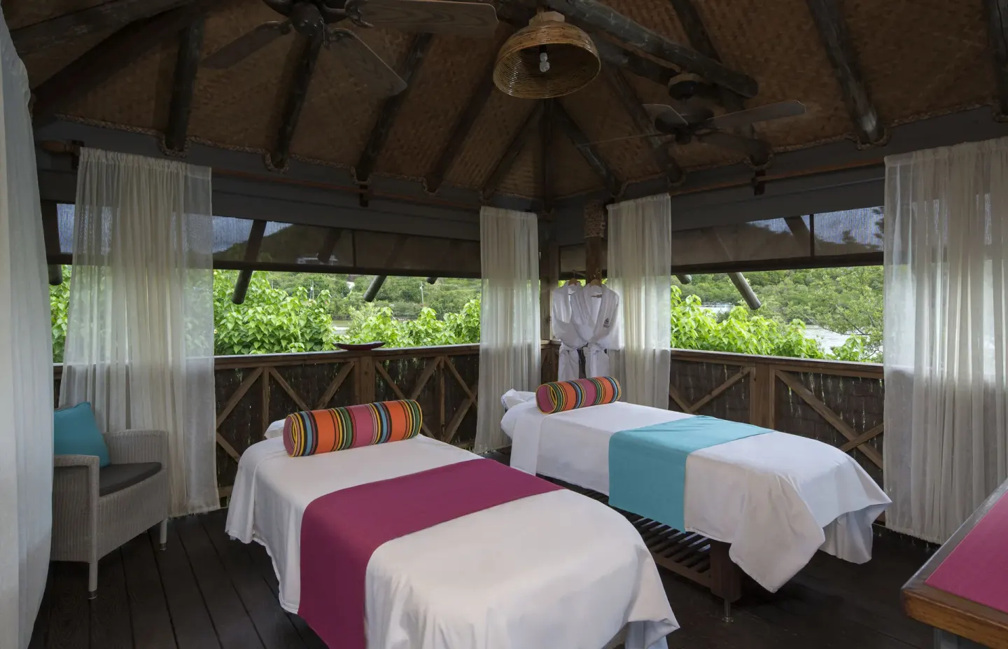 Open-air spa pavilion with two treatment beds at Galley Bay Resort & Spa.