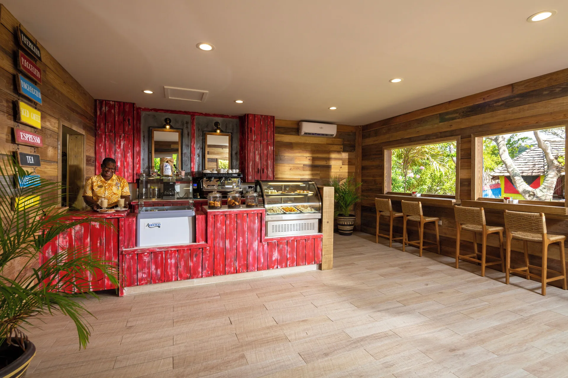 Coffee shop counter with indoor seating at Galley Bay Resort & Spa.